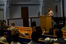 Chief Master Sgt. Marvin Parker, 36th Mission Support Group superintendent, speaks to attendees during the Martin Luther King Jr. Remembrance Ceremony Jan. 14, 2016, at Andersen Air Force Base, Guam. Parker’s speech linked the progress made since King’s time and the discriminatory incidents that happen today by following a theme of standing up in times of challenges. (U.S. Air Force photo/Airman 1st Class Jacob Skovo)
