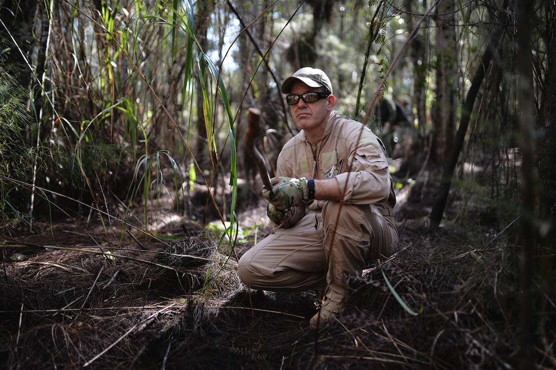 Air Force Master Sgt. Jerry Kurz pauses in the swamp during tactical movement training on Homestead Air Reserve Base, Fla., Jan. 18, 2016. Kurz is a combat search and rescue loadmaster instructor assigned to the 102nd Rescue Squadron. New York Air National Guard photo by Staff Sgt. Christopher S. Muncy