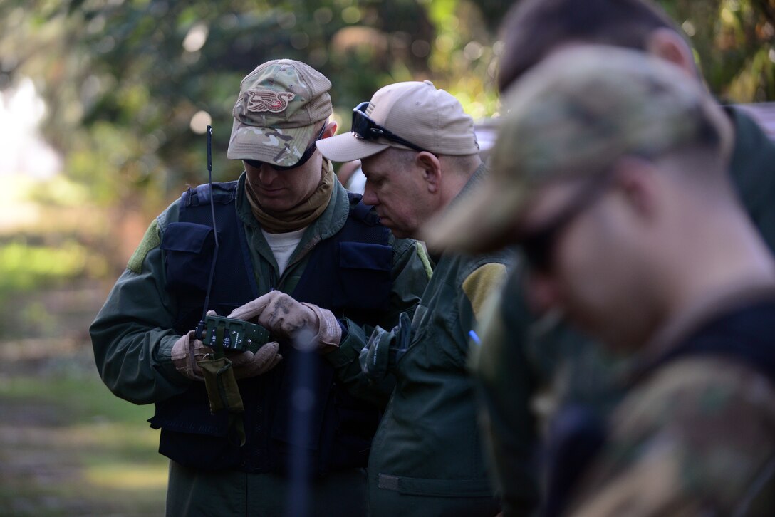 Airmen learn how to use a communication device during combat and water survival training on Homestead Air Reserve Base, Fla., Jan. 18, 2016. New York Air National Guard photo by Staff Sgt. Christopher S. Muncy