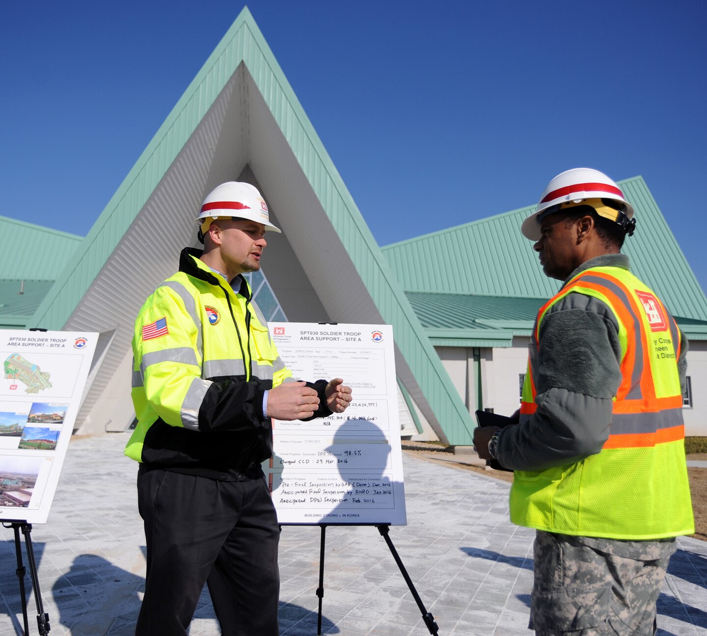 In this photo, Chaplain (Col.) Raymond A. Robinson, Jr., the USFK command chaplain (right), receives a briefing on the nearly completed chapel #1 from David M. Talbot, resident engineer of the Far East District's Family Housing Resident Office at Camp Humphreys (left).

One critical aspect of any military installation is a space that allows for service members to exercise their freedom of religion. For a military city, greater numbers and diversity demand more than just a single space. The first of four new chapels is slated to be put into use by mid-2016.

Until around 2014, U.S. Army Garrison-Humphreys personnel exercised their freedom of religion using one small chapel (the Freedom Chapel) and a small worship space in the 501st Military Intelligence area, said Robinson. Since the Freedom Chapel was demolished, the chaplains have been holding services in the Humphreys high school through a facility usage agreement with the Department of Defense Education Activity. 

“Many of us in the Far East District have been personally invested in the construction of these chapels, and we’re going to be just as excited as the rest of the Chapel community to see this and our other new chapels open up,” said Talbot.
