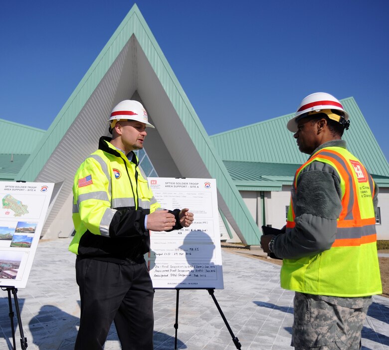 In this photo, Chaplain (Col.) Raymond A. Robinson, Jr., the USFK command chaplain (right), receives a briefing on the nearly completed chapel #1 from David M. Talbot, resident engineer of the Far East District's Family Housing Resident Office at Camp Humphreys (left).

One critical aspect of any military installation is a space that allows for service members to exercise their freedom of religion. For a military city, greater numbers and diversity demand more than just a single space. The first of four new chapels is slated to be put into use by mid-2016.

Until around 2014, U.S. Army Garrison-Humphreys personnel exercised their freedom of religion using one small chapel (the Freedom Chapel) and a small worship space in the 501st Military Intelligence area, said Robinson. Since the Freedom Chapel was demolished, the chaplains have been holding services in the Humphreys high school through a facility usage agreement with the Department of Defense Education Activity. 

“Many of us in the Far East District have been personally invested in the construction of these chapels, and we’re going to be just as excited as the rest of the Chapel community to see this and our other new chapels open up,” said Talbot.
