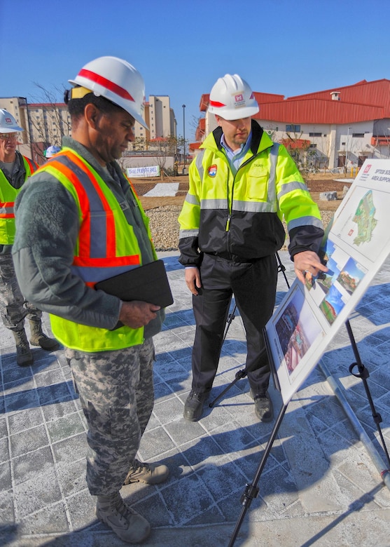 In this photo, Chaplain (Col.) Raymond A. Robinson, Jr., the USFK command chaplain (left), gets a briefing on the nearly completed chapel #1 from David M. Talbot, resident engineer of the Far East District's Family Housing Resident Office at Camp Humphreys (right).

One critical aspect of any military installation is a space that allows for service members to exercise their freedom of religion. For a military city, greater numbers and diversity demand more than just a single space. The first of four new chapels is slated to be put into use by mid-2016.

Until around 2014, U.S. Army Garrison-Humphreys personnel exercised their freedom of religion using one small chapel (the Freedom Chapel) and a small worship space in the 501st Military Intelligence area, said Robinson. Since the Freedom Chapel was demolished, the chaplains have been holding services in the Humphreys high school through a facility usage agreement with the Department of Defense Education Activity. 
“Many of us in the Far East District have been personally invested in the construction of these chapels, and we’re going to be just as excited as the rest of the Chapel community to see this and our other new chapels open up,” said Talbot.
