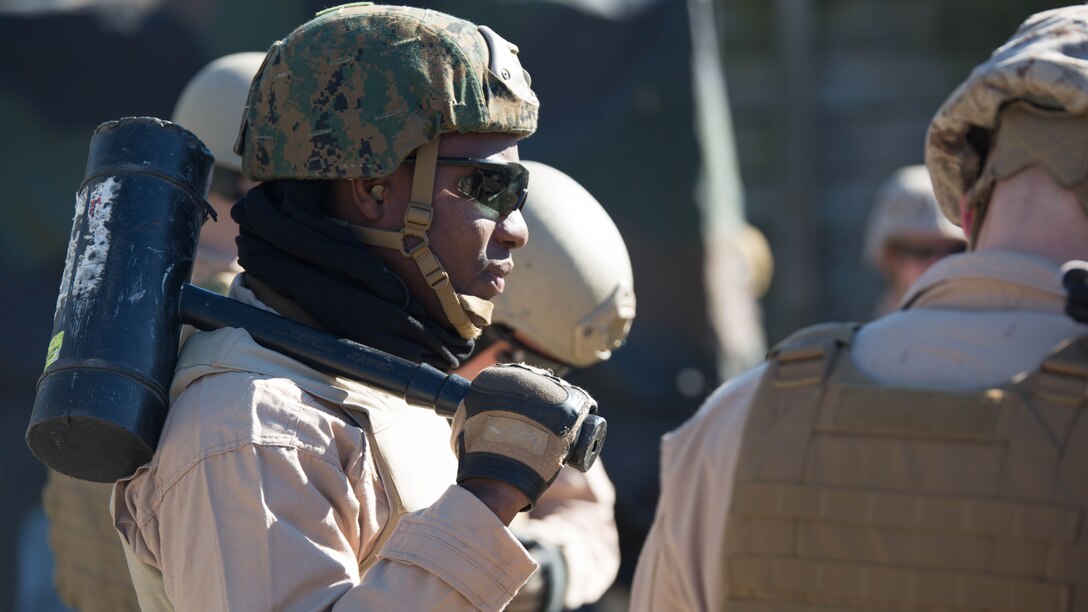 Sgt. Joseph Kharlange, an Explosive Ordinance Disposal technician with EOD Company, 8th Engineer Support Battalion, prepares for a simulated raid during a breaching course at Camp Lejeune, N.C., Jan. 14, 2016. The training is designed to incorporate different methods of entering a building, such as using a hammer to knock down the door in case the explosive fails, to prepare EOD for numerous scenarios they may encounter on a deployment. 