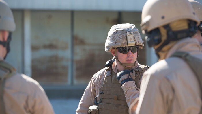 Sgt. Chris Fitzpatrick, an Explosive Ordinance Disposal technician with EOD Company, 8th Engineer Support Battalion, briefs his team before participating in a simulated raid during a breaching course at Camp Lejeune N.C., Jan. 14, 2016. Marines switch leadership positions throughout the entire course to keep the unit proficient. 