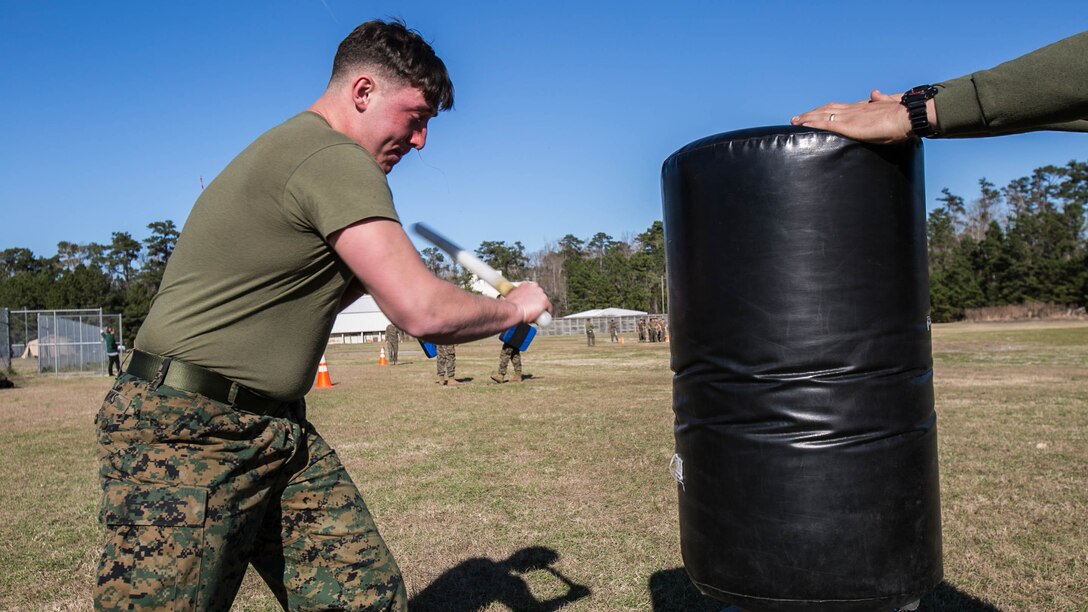 Lance Cpl. Hunter Rooks, a Marine with Combat Logistics Battalion 22, swings at a stationary target after being sprayed in the eyes with oleoresin capsicum, more commonly known as OC spray, at Camp Lejeune, N.C., Jan. 14. “I feel this was an effective means of instruction because if you or any of your Marines accidentally come in contact with the spray you’re going to know what to expect,” said Jolly. 