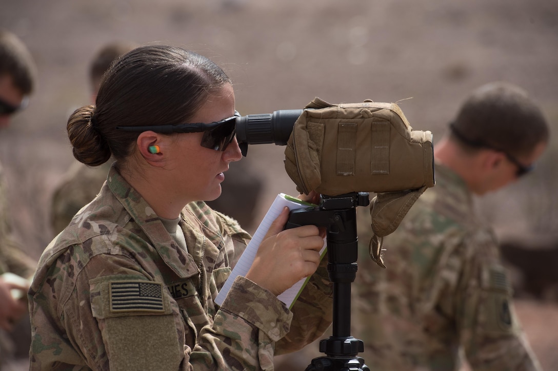 A U.S. soldier uses a spotting scope during long-range marksmanship training in Djibouti, Jan. 9, 2016. U.S. Air Force photo by Tech. Sgt. Barry Loo