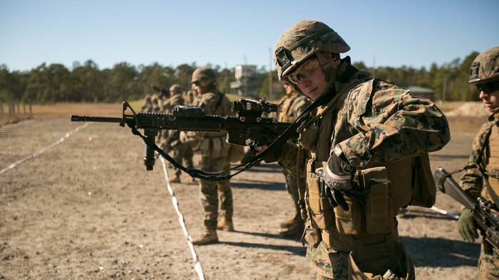 Lance Cpl. Sawyer Day, a combat engineer with Alpha Company, 2nd Combat Engineer Battalion, reloads his weapon during a Combat Marksmanship Program qualification. Marines conduct these qualifications yearly in order to remain combat ready in case they are called upon at a moment's notice.