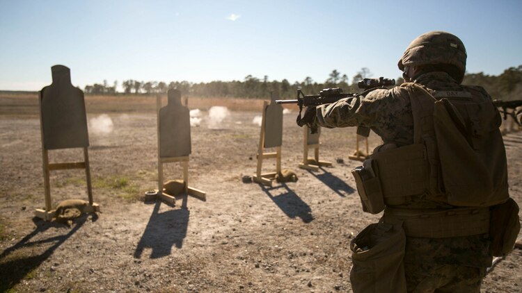 Lance Cpl. Sawyer Day, a combat engineer with Alpha Company, 2nd Combat Engineer Battalion, fires at a target during a Combat Marksmanship Program qualification. Completed annually, this training helps Marines hone in on their skills as riflemen. The CMP shoot consists of a series of drills which make the Marine simulate close-range, fire and maneuver combat operations. 
