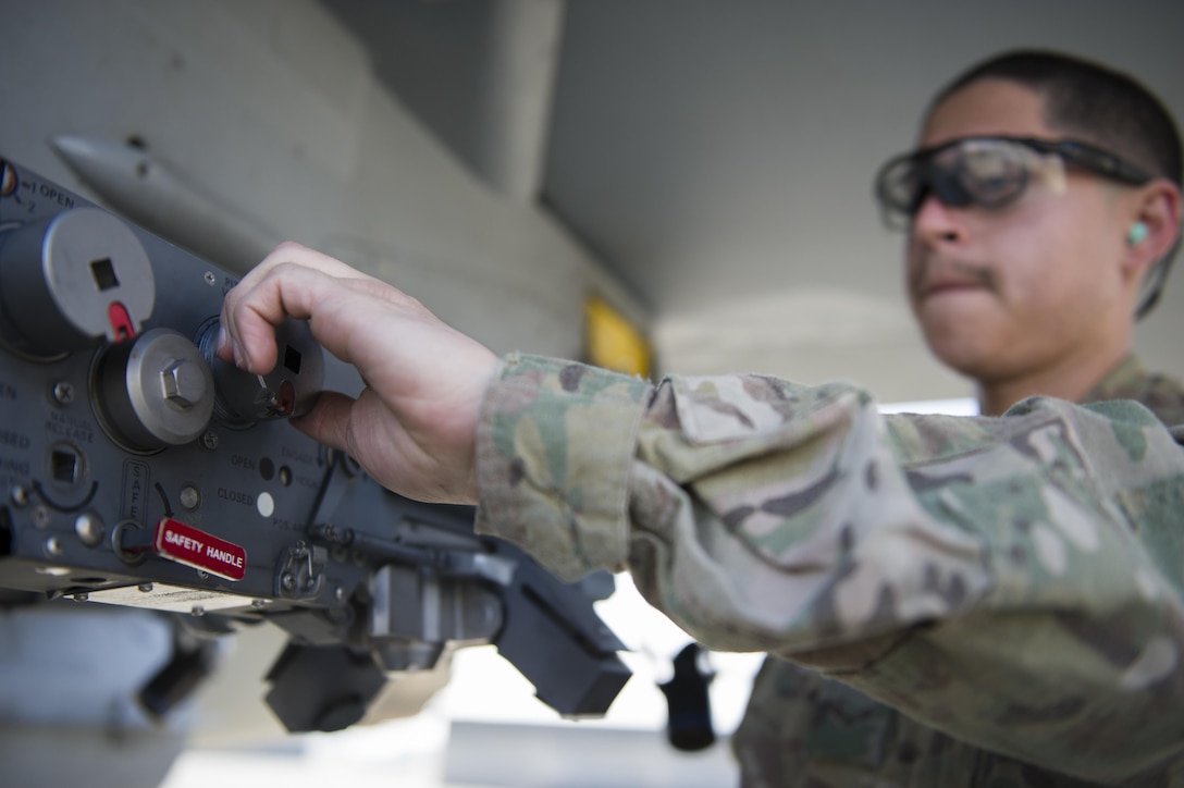 Air Force Airman 1st Class Gabriel Rey installs an impulse cartridge retainer during a 30-day inspection on Bagram Airfield, Afghanistan, Jan. 15, 2016. U.S. Air Force photo by Tech. Sgt. Robert Cloys 