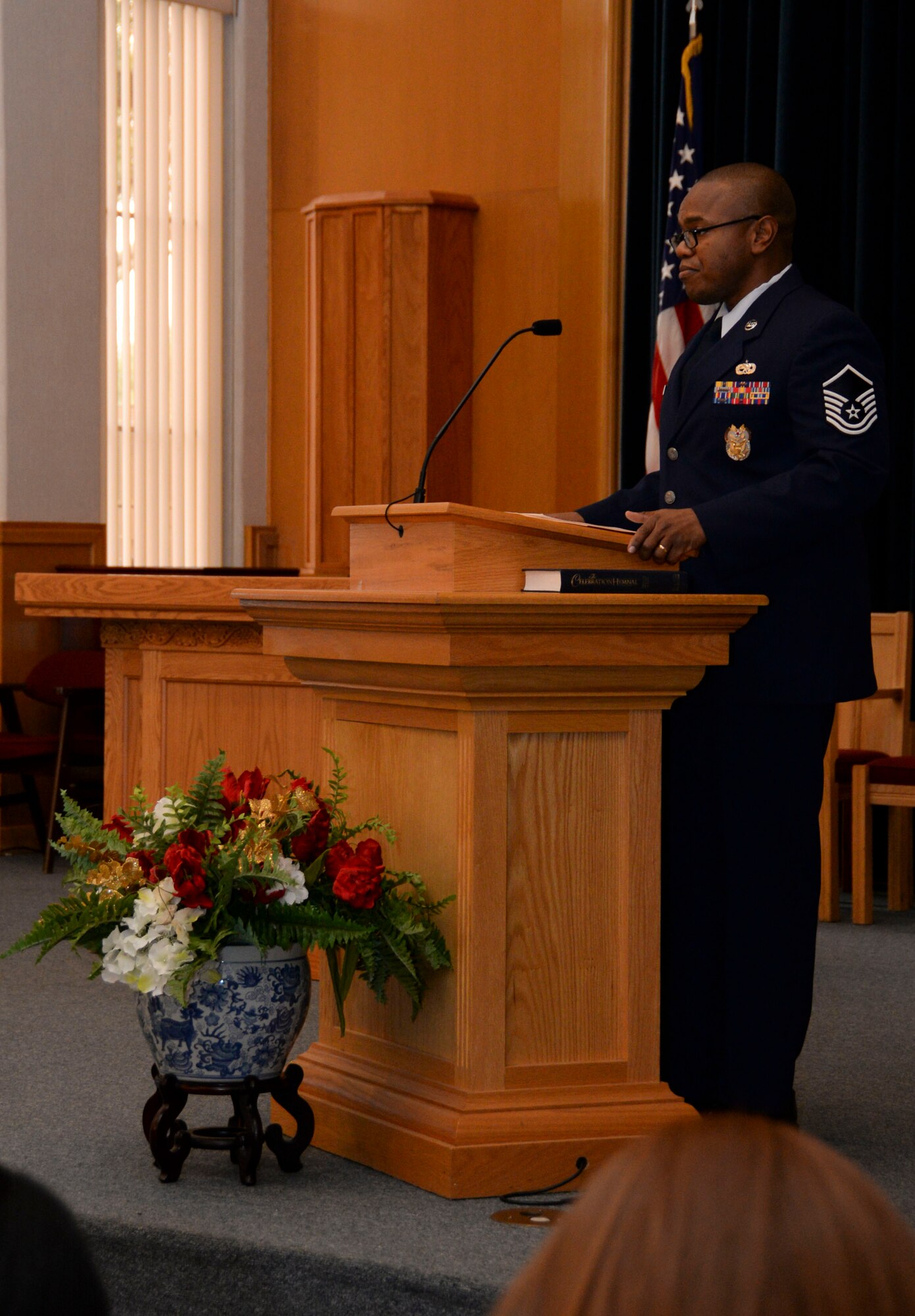 Master Sgt. Edner Francois, African American Heritage Committee member, welcomes guests to the Martin Luther King Jr. commemorative worship service at Barksdale Air Force Base, La., Jan. 14, 2016. This year’s theme, Called to Serve, highlighted King’s commitment to serving his community. This event acted as a reminder to honor his legacy of helping others regardless of race or status. (U.S. Air Force photo by Senior Airman Amanda Morris)