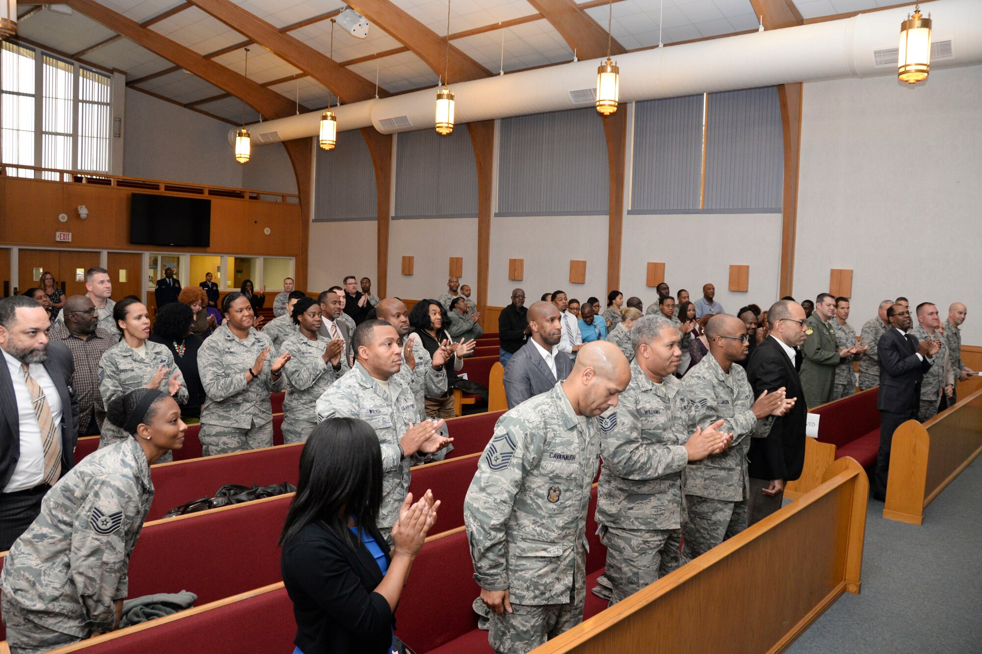 The audience celebrates the ministry and message of the Martin Luther King Jr. commemorative worship service at Barksdale Air Force Base, La., Jan. 14, 2016. More than 50 people attended the worship service to pay tribute to King and his legacy of serving his community. (U.S. Air Force photo by Senior Airman Amanda Morris)