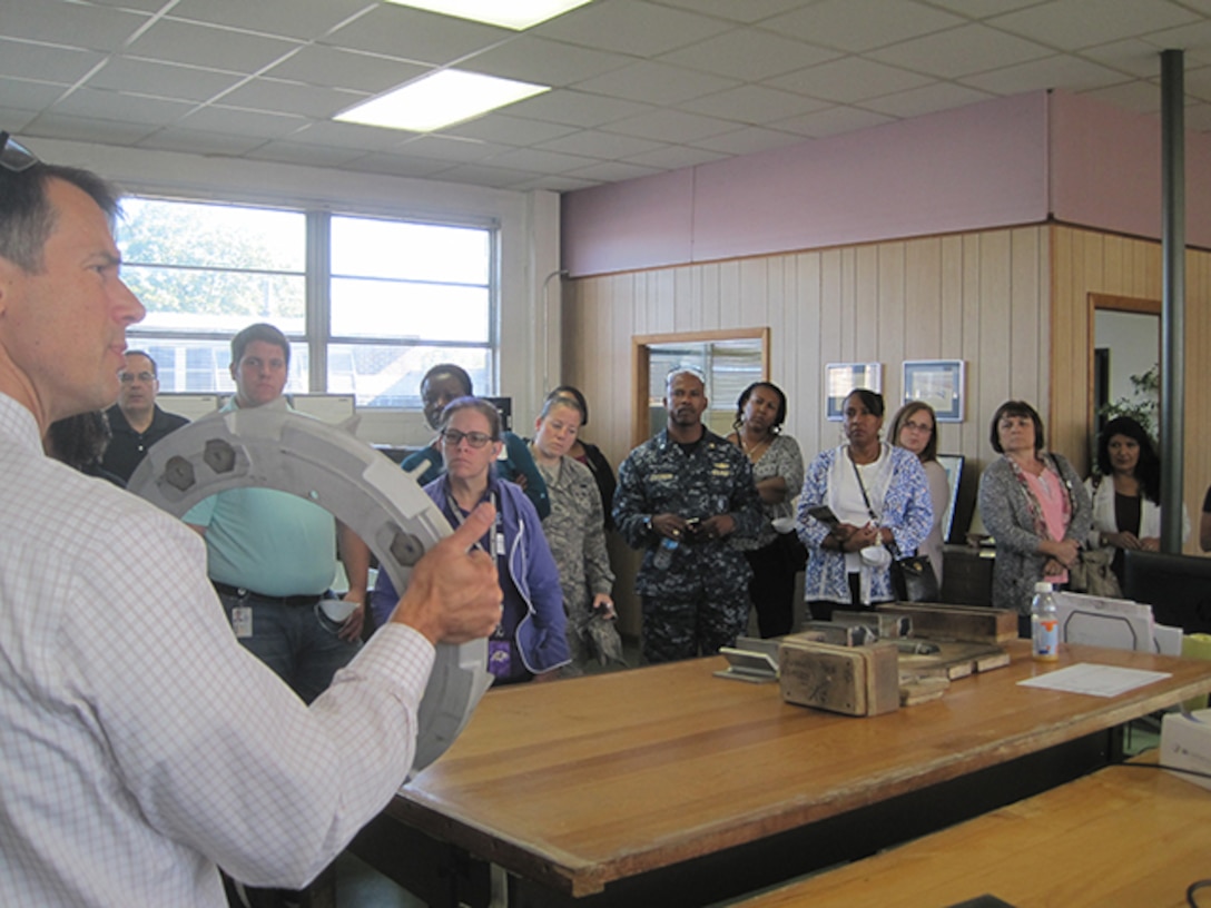 John Danko, owner of Danko Arlington Foundry, displays a casting pattern developed with additive manufacturing processes to Defense Logistics Agency Aviation employees visiting his family’s foundry during DLA Aviation’s Forging and Casting Assistance Team’s September 2015 “Introduction to Metal Casting and Forging” Technology Transfer Seminar. (DLA Aviation Courtesy Photo)                   