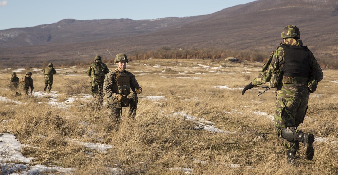 U.S. Marines and Romanian forces rehearse a breach of an anti-personnel obstacle breaching system during Platinum Lion 16-2 at Novo Selo Training Area, Bulgaria, Jan. 8, 2016. The training is used to clear a foot-wide path through a wire, mine field, or obstacle. U.S. Marine Corps photo by Cpl. Justin T. Updegraff