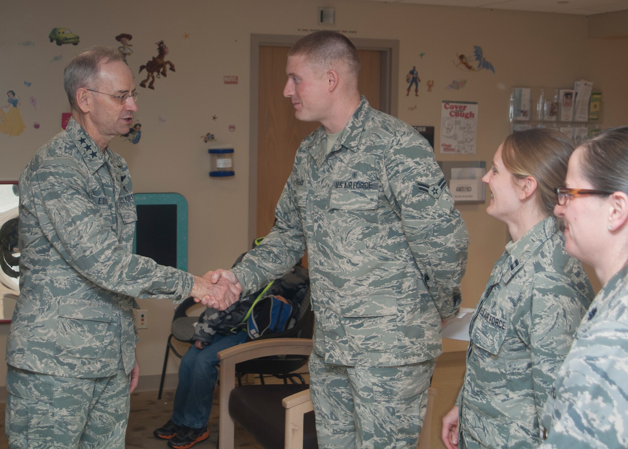 Lt. Gen. Mark Ediger, the Air Force Surgeon General, meets Airman 1st Class Cody Sellick, Capt. Michelle Kiger and Lt. Col. (Dr.) while during his visit to the Wright-Patterson Medical Center on Jan. 13, 2015. 