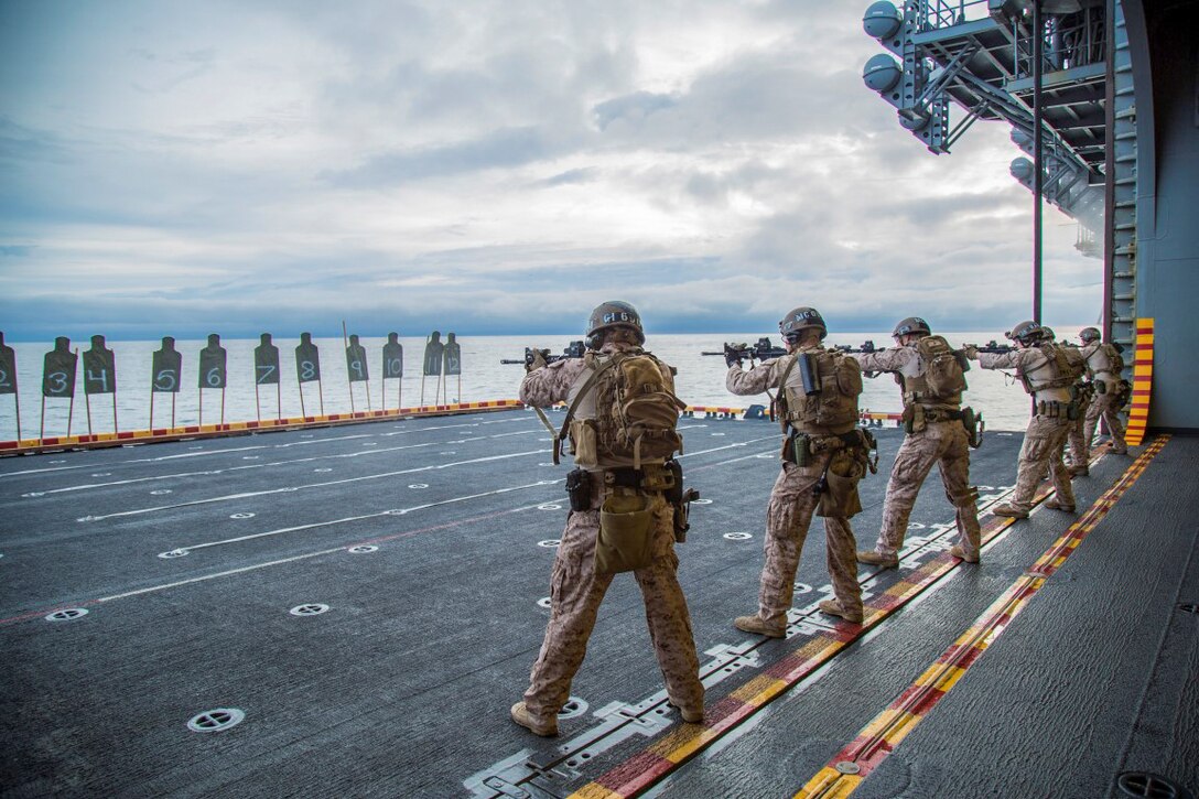 U.S. Marines shoot during an exercise aboard the USS Boxer, Jan. 18, 2016. The exercise reinforces the execution of mission essential tasks to prepare for an upcoming deployment. The Marines are assigned to Maritime Raid Force, 13th Marine Expeditionary Unit. U.S. Marine Corps photo by Sgt. Hector de Jesus