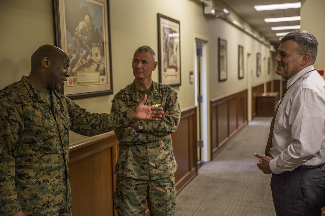 Sergeant Major of the Marine Corps, Sgt. Maj. Ronald L. Green (left), greets Lt. Gen. Rex C. McMillian (center), Commander of Marine Forces Reserve and Marine Forces North and Mr. Gregg T. Habel (right), Executive Director of MARFORRES and Marine Forces North upon arrival at Marine Corps Support Facility New Orleans, Jan. 20, 2015. Green’s visit entails getting to know his Marines better as well as discuss the 'Protect What You've Earned' campaign by urging Marines to protect what they’ve earned as a Marine and continue to uphold the standards of the Corps on and off duty. 