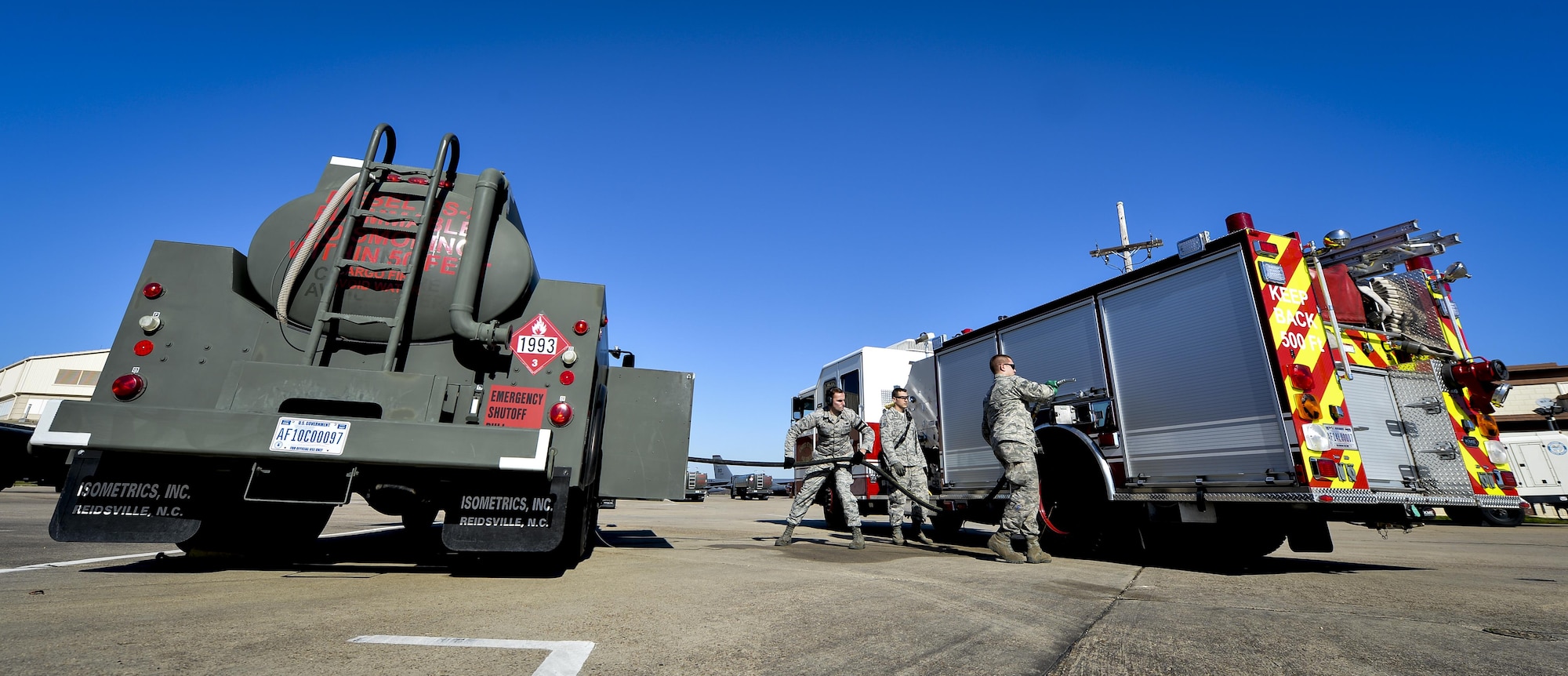 Fuel distribution operators from the 2nd Logistics Readiness Squadron, prepare to fuel a fire truck at Barksdale Air Force Base, La., Jan. 12, 2016. Distribution flight Airmen supply three fire stations and a number of emergency response vehicles with fuel daily. (U.S. Air Force photo/Airman 1st Class Mozer O. Da Cunha)