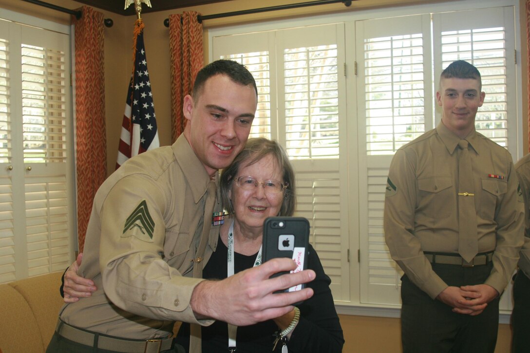 Martha Braden, 79, the mother of a retired Marine Corps major, poses for a selfie with Sgt. John Zecher, Marine Corps Intelligence Activity. Marines visited Heatherwood Retirement Community in Burke, Virginia, for coffee and conversation with the residents on Jan. 14.