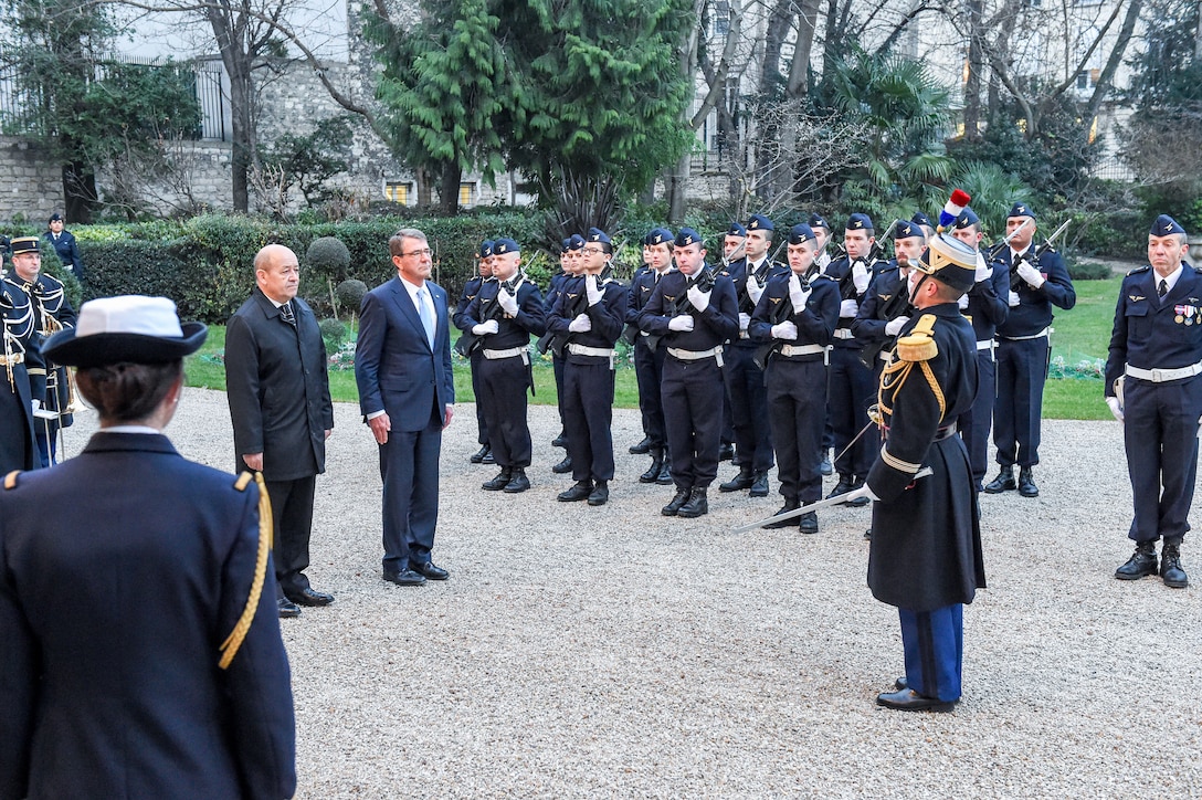 U.S. Defense Secretary Ash Carter, right, and French Defense Minster Jean-Yves Le Drian attend and honors ceremony in Paris, Jan. 20, 2016. Carter and Le Drian met to discuss efforts to fight the Islamic State of Iraq and the Levant. DoD photo by Army Sgt. 1st Class Clydell Kinchen