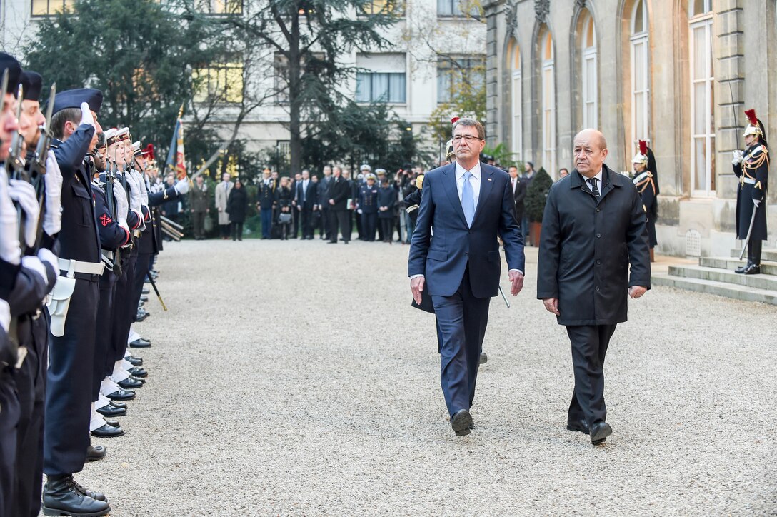U.S. Defense Secretary Ash Carter, left, and French Defense Minster Jean-Yves Le Drian attend an honors ceremony in Paris, Jan. 20, 2016. DoD photo by Army Sgt. 1st Class Clydell Kinchen