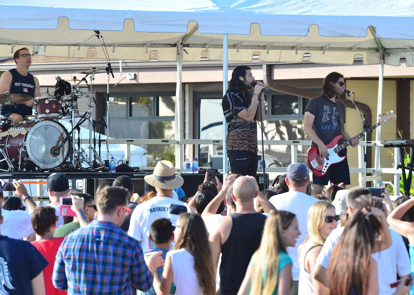 Military members and their family watch the band Magic! perform during Beach Fest on Joint Base Pearl Harbor-Hickam, Hawaii, Jan. 16, 2016. Beach Fest, a joint event held by MWR and Armed Forces Entertainment brought games and entertainment together with a live concert. (U.S. Air Force photo by Tech. Sgt. Aaron Oelrich/Released)   