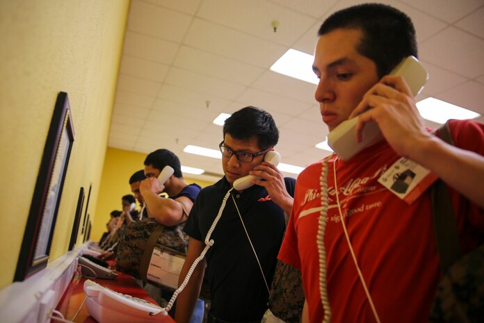 Recruits of Mike Company, 3rd Recruit Training Battalion, make their phone calls home, reading only what is printed on the script in front of them, during receiving at Marine Corps Recruit Depot San Diego, Jan. 19. Recruits will not be able to make another phone call until the end of recruit training. Annually, more than 17,000 males recruited from the Western Recruiting Region are trained at MCRD San Diego. Mike Company is scheduled to graduate April 15.