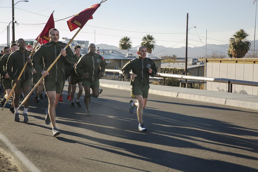 Sgt. Maj. Avery L. Crespin, sergeant major, Headquarters Battalion, leads Headquarters Battalion during a unit run through the Combat Center, Jan. 15, 2016. (Official Marine Corps photo by Lance Cpl. Thomas Mudd/Released)