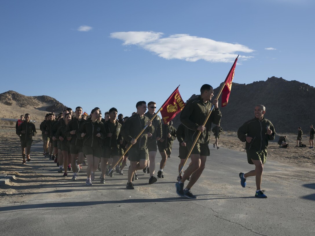 Sgt. Maj. Avery L. Crespin, sergeant major, Headquarters Battalion, talks with the Marines next to him during a unit run through the Combat Center, Jan. 15, 2016. (Official Marine Corps photo by Sgt. Charles Santamaria)