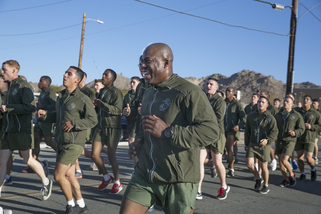 First Sgt. Frank O. Robinson, Company A First Sergeant, Headquarters Battalion, sings cadence during a battalion run through the Combat Center, Jan. 15, 2016. (Official Marine Corps photo by Sgt. Charles Santamaria/Released)