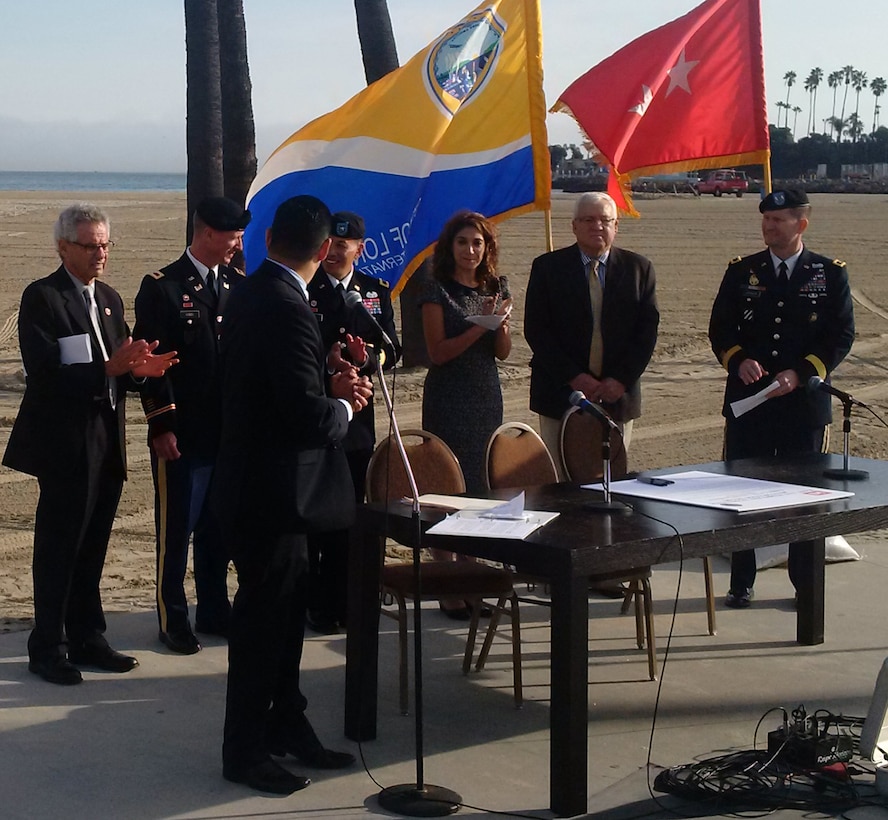 Mayor Robert Garcia, City of Long Beach; U.S. Congressman Alan Lowenthal of Long Beach; Col. Kirk Gibbs, Los Angeles District Commander, U.S. Army Corps of Engineers; Brig. Gen. Mark Toy, South Pacific Division Commander, U.S. Army Corps of Engineers; Councilwoman Suzie Price, City of Long Beach; Steven L. Stockton Director of Civil Works, U.S. Army Corps of Engineers; and Maj. Gen. Ed Jackson, U.S. Army Corps of Engineers Deputy Commanding General for Civil and Emergency Operations speak at a ceremony celebrating the signing of shared cost study for the ecological restoration of the East San Pedro Bay.