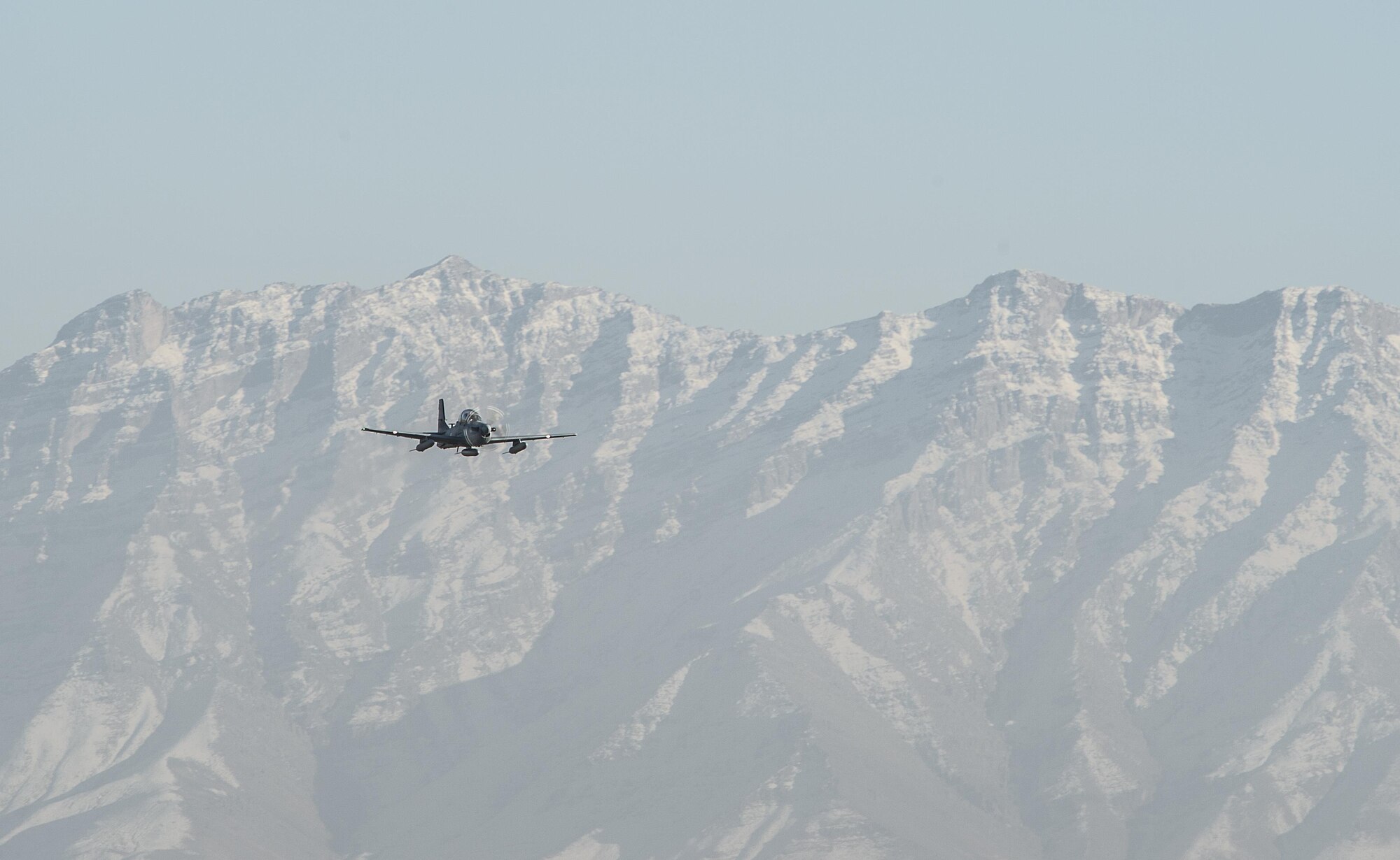 An A-29 Super Tucanos flies over Hamid Karzai International Airport, Afghanistan, Jan. 15, 2016. The aircraft will be added to the Afghans' inventory in the spring of 2016. The A-29 Super Tucano is a 'light air support' aircraft capable of conducting close air support, aerial escort, armed overwatch and aerial interdiction. Designed to operate in high temperature and in extremely rugged terrain, the A-29 Super Tucano is highly maneuverable 4th generation weapons system capable of delivering precision guided munitions. It can fly at low speeds and low altitudes, is easy to fly, and provides exceptionally accurate weapons delivery. It is currently in service with 10 different air forces around the world. (U.S. Air Force photo by Tech. Sgt. Nathan Lipscomb)
