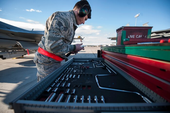 Senior Airman Jarred Eads, Tomahawk Aircraft Maintenance Unit weapons load crew member, inspects his crew’s tool kit during a quarterly weapons load crew competition at Nellis Air Force Base, Nev., Jan. 8, 2016. Crews are inspected on their dress and appearance, orderliness of their tool boxes, the weapons load, and a written test to determine the 57th Maintenance Group’s best weapons load crew of the quarter or year. (U.S. Air Force photo by Staff Sgt. Siuta B. Ika)