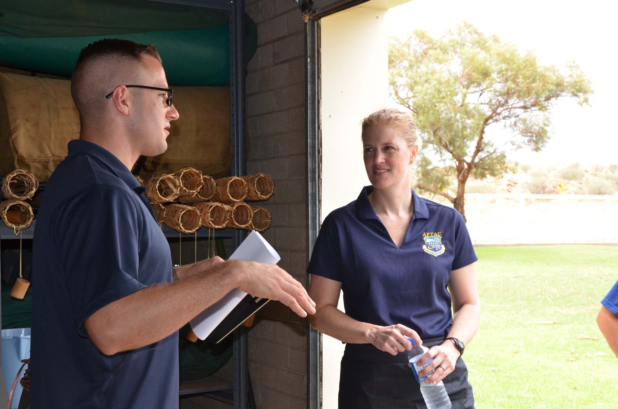 Tech. Sgt. Peter Olivieri, a seismic technician at Detachment 421 in Alice Springs, Australia, briefs his commander, Col. Jennifer P. Sovada, during her visit to the detachment Dec. 16, 2015.  Sovada commands the Air Force Technical Applications Center at Patrick AFB, Fla., and the Airmen at the unit in Australia's Northern Territory contribute to the center's worldwide nuclear treaty monitoring mission.  (U.S. Air Force photo by Susan A. Romano)
