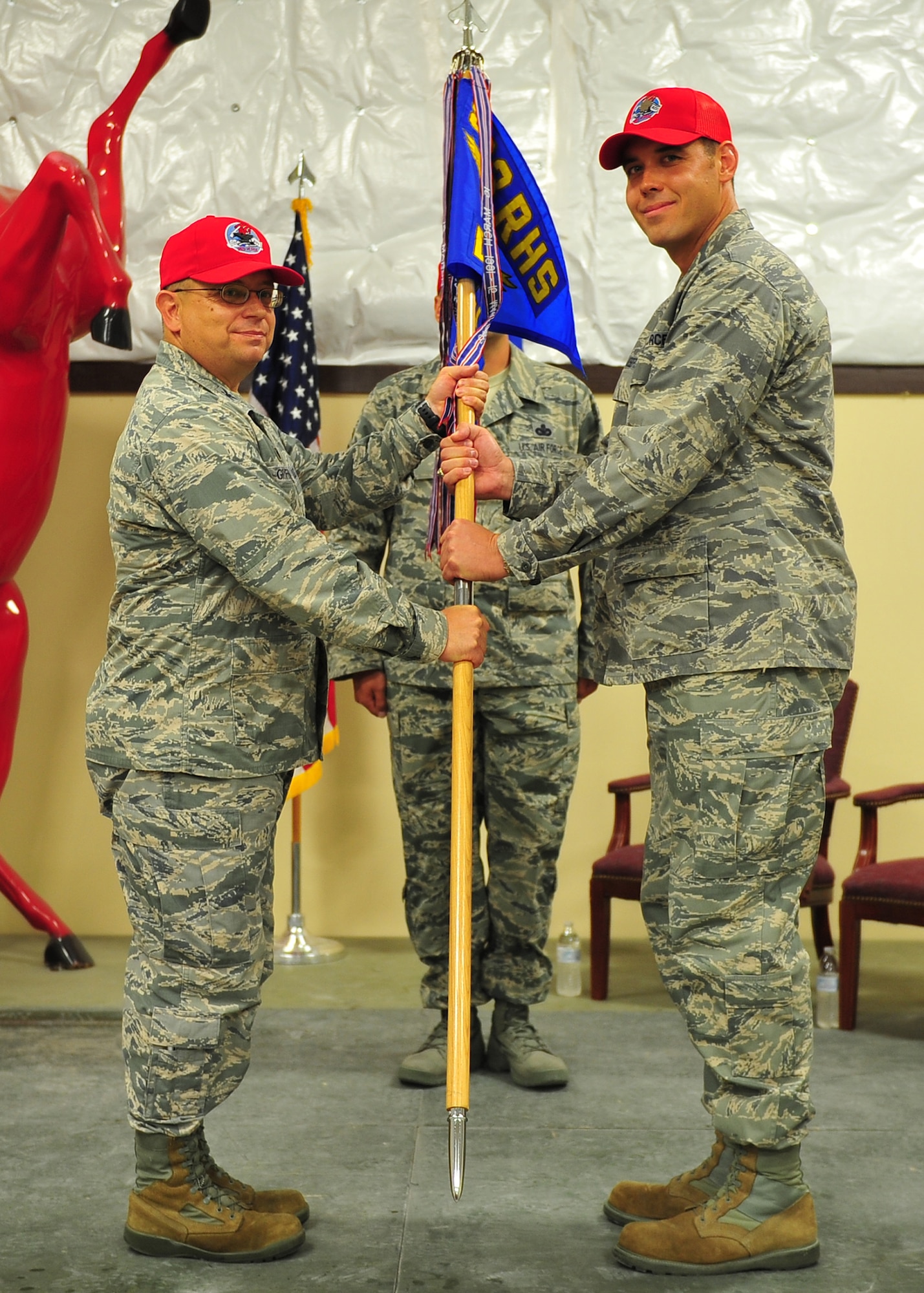 Major Matthew Joseph, commander of the 823rd Red Horse Squadron, Detachment 1 receives the guidon, July 2015.  Joseph took command of Tyndall’s Silver Flag readiness and training mission and has ensured that civil engineers, communications, force Support, and finance personnel learn how to build and maintain bare-base operations at a forward-deployed location.  (U.S. Air Force photo by Senior Airman Dustin Mullen/Released) 