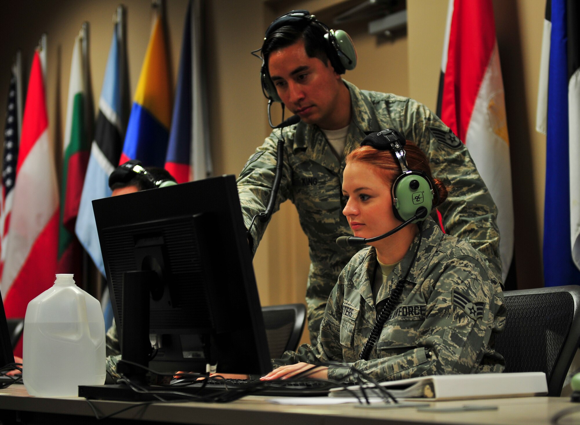 Senior Airman Amanda Masters, 337th Air Control Squadron weapons simulation technician, practices her skills while Staff Sgt. Steven King, 337th ACS pilot simulator, looks on at the 337th ACS building, Jan. 13. Masters was selected by her leadership to be the squadrons “Unsung Hero” for her dedication and excellence. (U.S. Air Force photo by Senior Airman Dustin Mullen/Released)