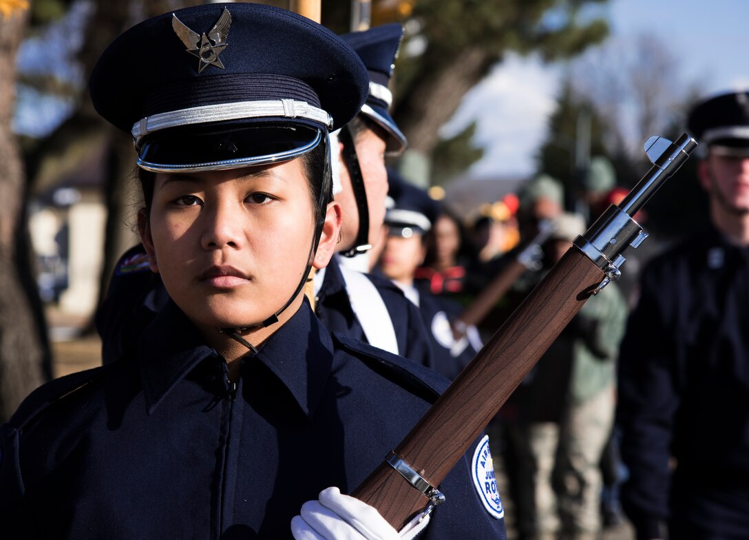Cadet Airman Rissa Basa Cabral, an Edgren High School Junior Reserve Officer Training Corps member,  holds a rifle while marching at Misawa Air Base, Japan, Jan. 15, 2016. Basa Cabral led the Martin Luther King, Jr. Day observance march. The march started at the Enlisted Club and ended at Edgren High School where an assembly was held in honor of MLK Day. King was the chief spokesman for nonviolent activism in the Civil Rights Movement, which successfully protested racial discrimination in federal and state law.  (U.S. Air Force photos by Senior Airman Brittany A. Chase)