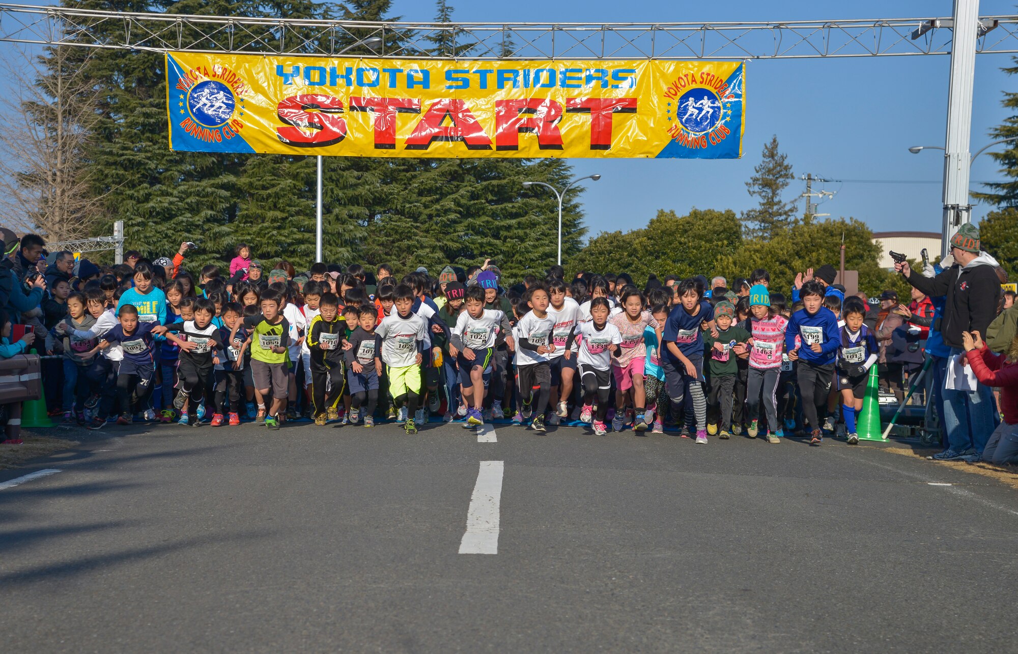 Children begin a 2k children race during the 35th Annual Frostbite Run at Yokota Air Base, Japan, Jan. 17, 2015. The run had approximately 9,000 participants. (U.S. Air Force photo by Senior Airman David Owsianka/Released)