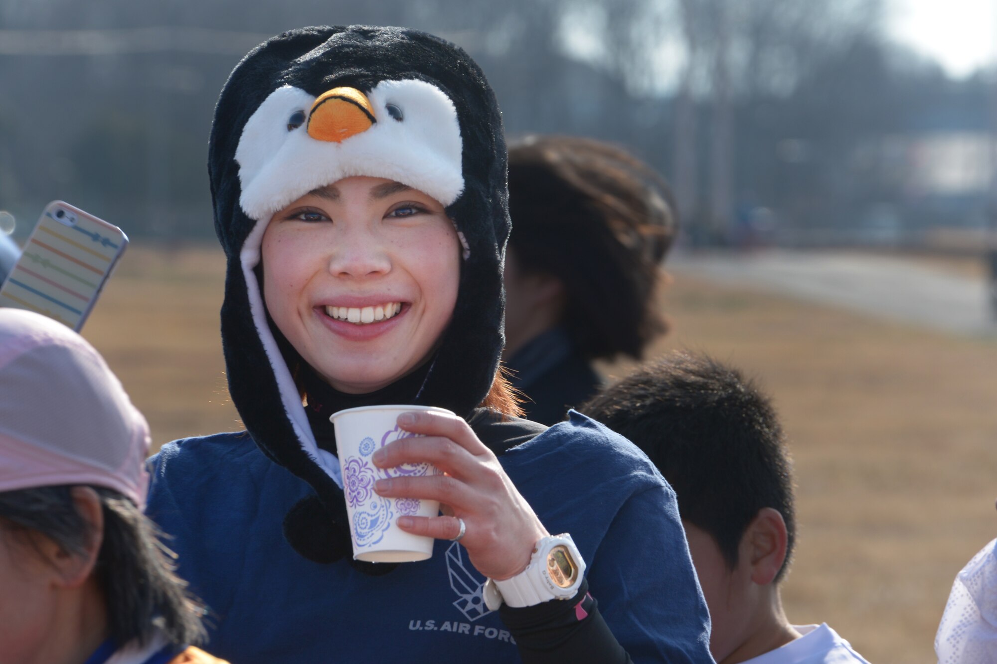 A participants takes a break to hydrate during the 35th Annual Frostbite Run at Yokota
Air Base, Japan, Jan. 17, 2016. The event offered multiple race options to participants
as well as a number of booths with U.S. foods and items. More than 9,000 people
participated in the annual event. (U.S. Air Force photo by Staff Sgt. Cody H. Ramirez/
Released)