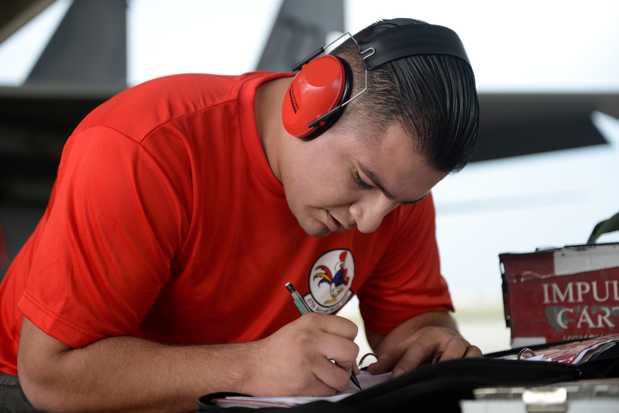 U.S. Air Force Senior Airman Adan Lopez, 67th Aircraft Maintenance Unit weapons load crew chief, writes in all of the data for his aircraft during a weapons load competition on Jan. 8, 2016, at Kadena Air Base, Japan. The weapons load competition was for the first quarter of 2016. The 44th and 67th Aircraft Maintenance Units host four weapons load competitions each year, leading up to an annual competition at the end of the year. The competitions give the Airmen from the units a chance to show off their capabilities while promoting friendly competition and safe practices for future operations. (U.S. Air Force photo by Senior Airman Stephen G. Eigel)