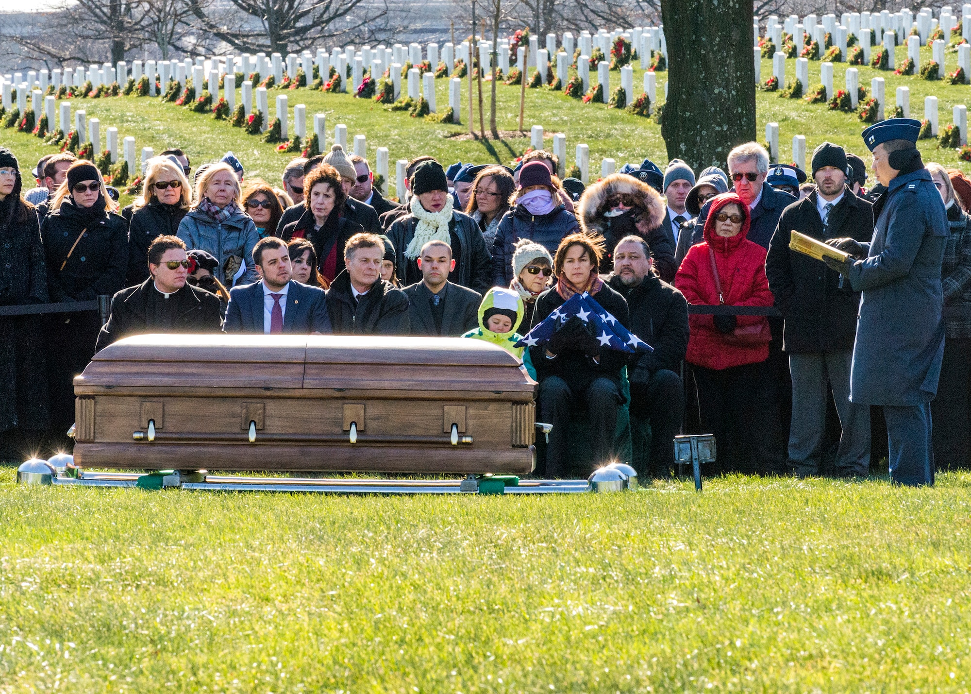 Family and friends gather at Arlington National Cemetery Jan. 19 to honor the memory of Air Force Office of Special Investigations Special Agent (Maj.) Adrianna M. Vorderbruggen who was one of six Airmen killed by a suicide bomber near Bagram Air Base, Afghanistan, Dec. 21, 2015. (U. S. Air Force photo/Special Agent Cameron MacKenzie) 