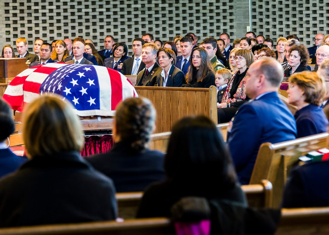 Mourners reflect during the funeral service at the Fort Myer, Va., Memorial Chapel Jan. 19 for Air Force Office of Special Investigations Special Agent (Maj.) Adrianna M. Vorderbruggen who was one of six Airmen killed by a suicide bomber near Bagram Air Base, Afghanistan, Dec. 21, 2015. (U. S. Air Force photo/Michael Hastings) 