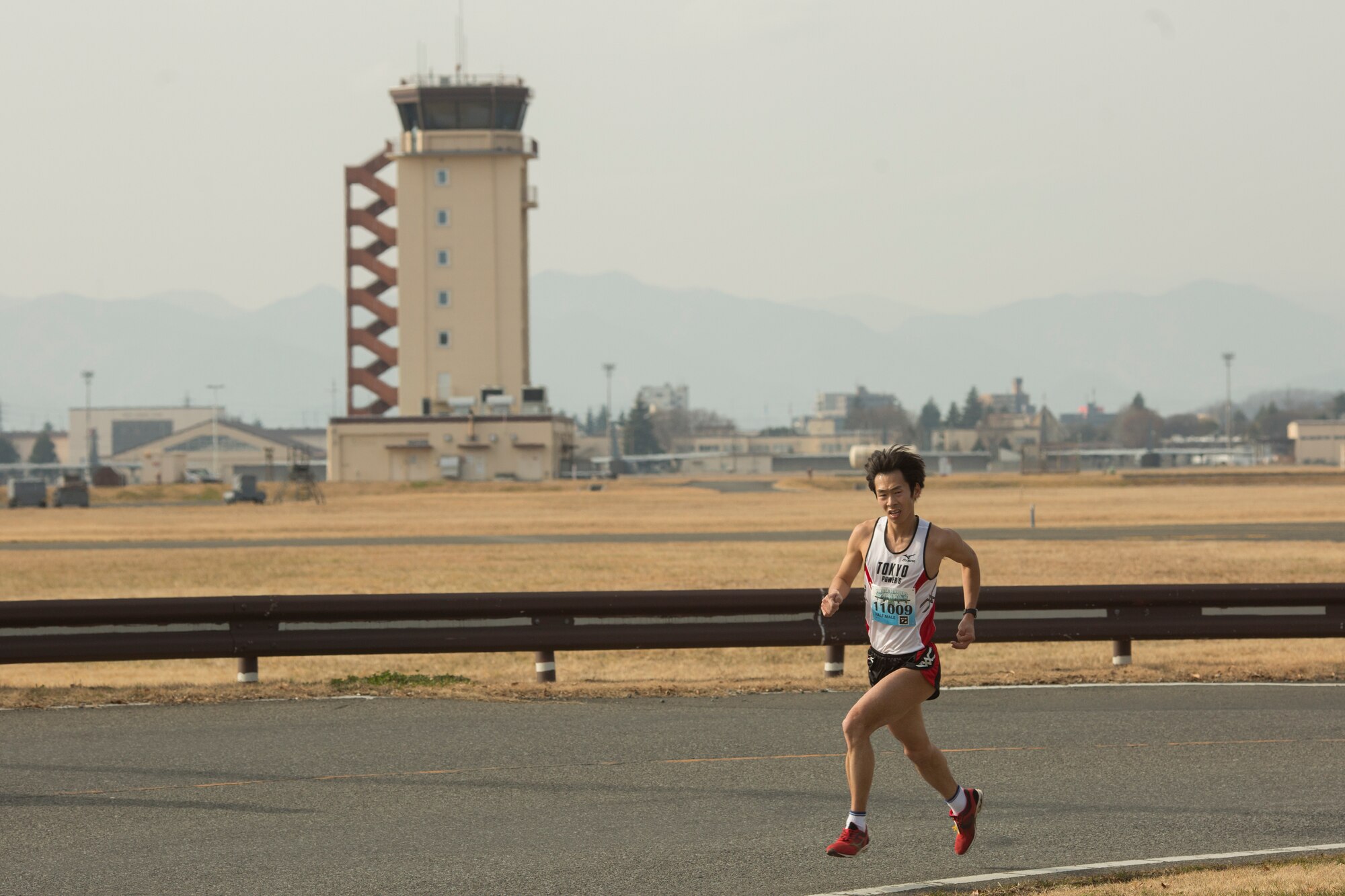 Akio Tsukamoto runs in the half marathon during the 35th Annual Frostbite Run at Yokota Air Base, Japan, Jan. 17, 2016. Tsukamoto won first place by 1:11:05. Team Yokota hosted over 9,000 participants for the race. (U.S. Air Force photo by Osakabe Yasuo/Released)