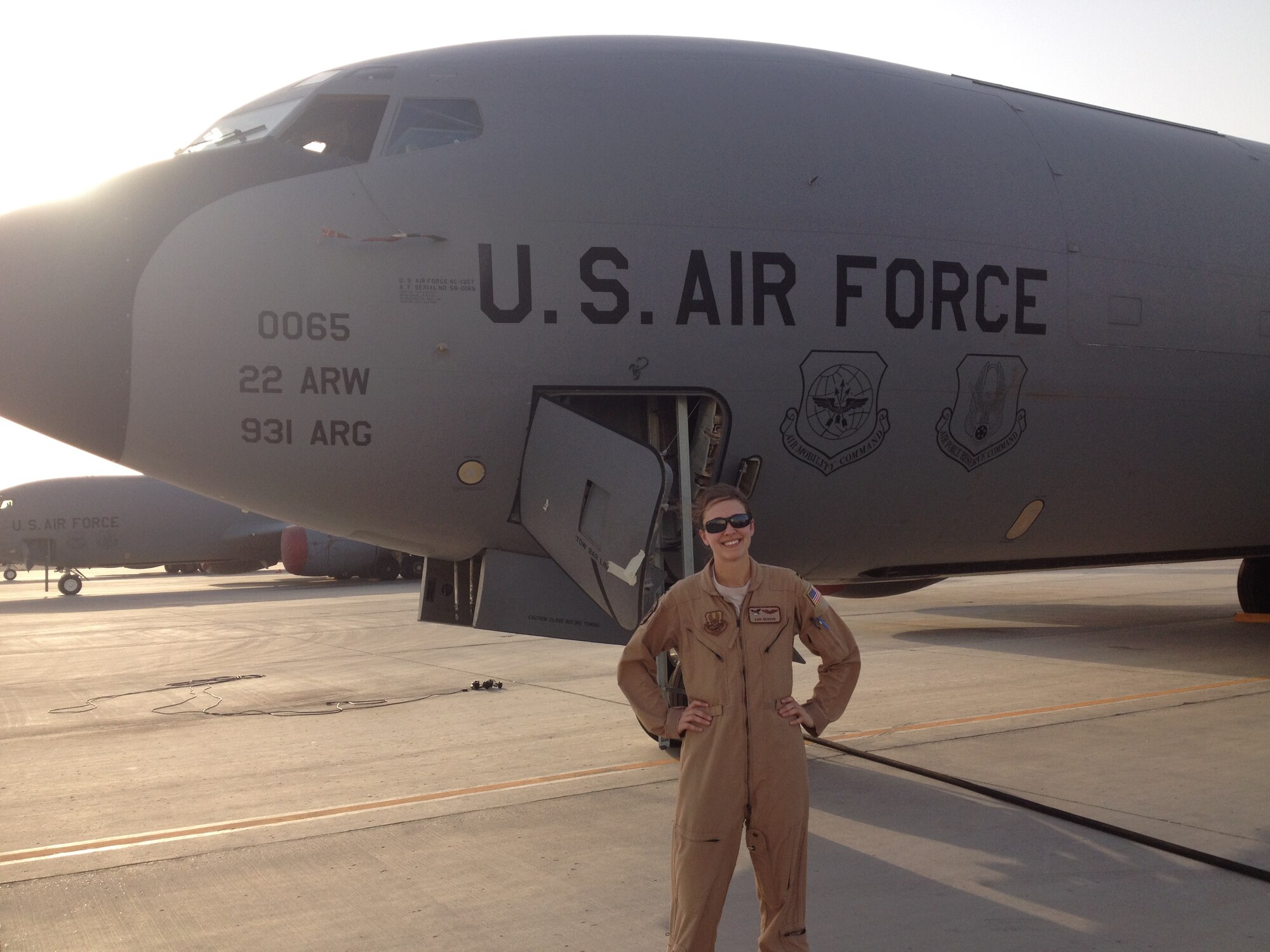 Capt. Kari Benson, 344th Air Refueling Squadron KC-135 Stratotanker pilot, stands in front of a KC-135 during a deployment in June 2015. Benson has deployed five times since her arrival to McConnell Air Force Base, Kan., in 2012. (Courtesy photo)