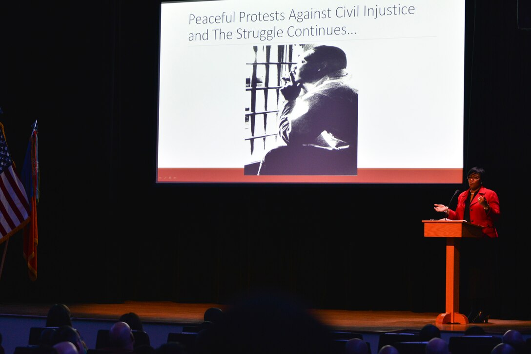 Dr. Kadijah O. Miller, department head of history and interdisciplinary studies at Norfolk State University, speaks during a Dr. Martin Luther King Day Celebration at Fort Eustis, Va., Jan. 13, 2016. Miller hailed the efforts and accomplishments Dr. King and his supporters made toward the Civil Rights Movement. (U.S. Air Force photo by Staff Sgt. Natasha Stannard)