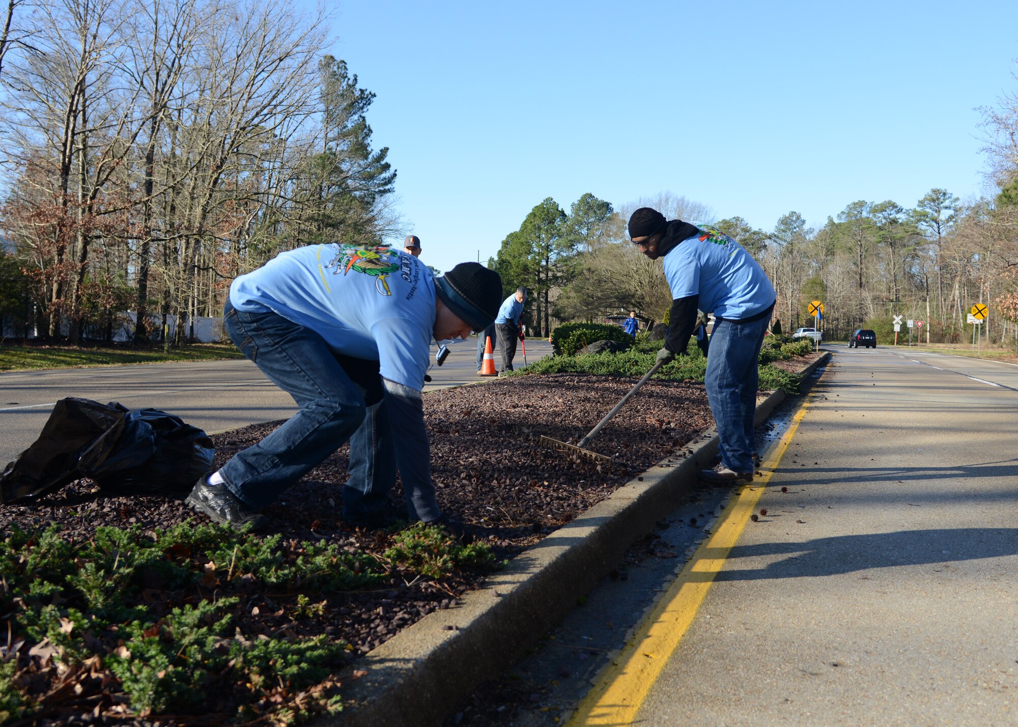 U.S. Army Staff Sgt. Richard Sheetz and Sgt. 1st Class Jason Cheely, members of the Fort Eustis chapter of the Sergeant Audie Murphy Club (SAMC), collect litter and rake stones at the Gate 1 entrance at Fort Eustis, Va., Jan. 16, 2016. The SAMC is formally adopting the grounds of Fort Eustis’ main entrance, and will periodically perform cleanup projects in the area. (U.S. Air Force photo by Staff Sgt. Jason J. Brown)
