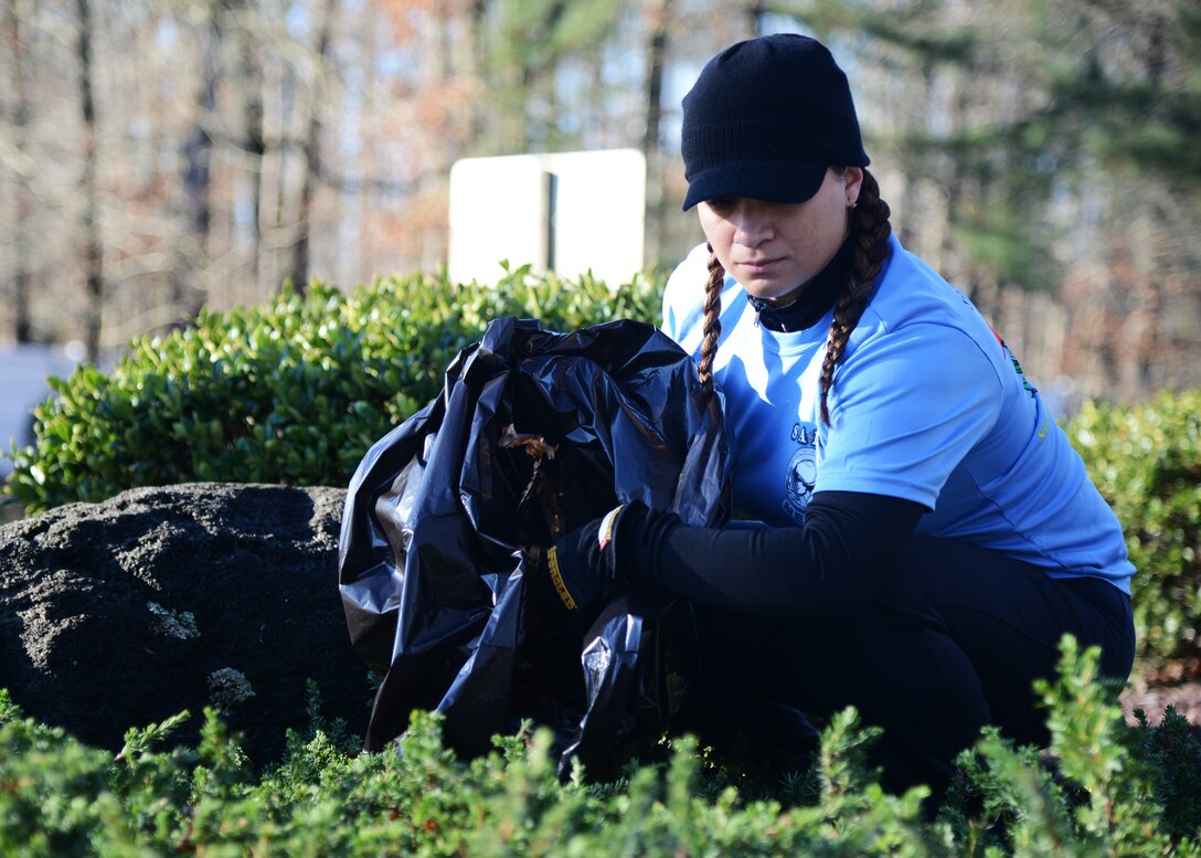U.S. Army Sgt. 1st Class Edith Canada, a member of the Fort Eustis chapter of the Sergeant Audie Murphy Club (SAMC), collects and bags litter during the SAMC beautification project at Fort Eustis, Va., Jan. 16, 2016. The SAMC is a private U.S. Army organization for noncommissioned officers that exemplify the ideals of leadership, compassion and professionalism, to which members must be recommended by their chain of command and participate in a rigorous board examination process. (U.S. Air Force photo by Staff Sgt. Jason J. Brown)