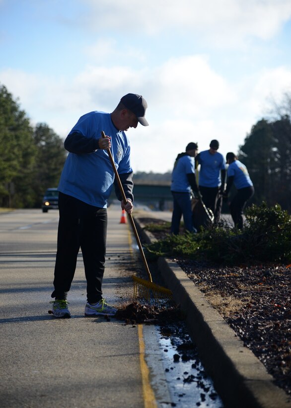 U.S. Army Command Sgt. Maj. David S. Davenport, command sergeant major of the U.S. Army Training and Doctrine Command, sweeps debris along Fort Eustis Boulevard during the Sergeant Audie Murphy Club beautification project at Fort Eustis, Va., Jan. 16, 2016. Davenport commended the Soldiers on their efforts, and reinforced the importance of professionalism, appearance and community in his conversations with the volunteers. (U.S. Air Force photo by Staff Sgt. Jason J. Brown)