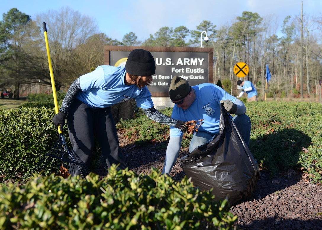 U.S. Army Staff Sgt. ReTina McCarter and Sgt. Maj. Norman McAfee, members of the Fort Eustis chapter of the Sergeant Audie Murphy Club, collect litter at the Gate 1 entrance at Fort Eustis, Va., Jan. 16, 2016. Volunteers also resurfaced stone areas and cleaned gutters and curbs along Fort Eustis Boulevard as part of the cleanup effort. (U.S. Air Force photo by Staff Sgt. Jason J. Brown) 