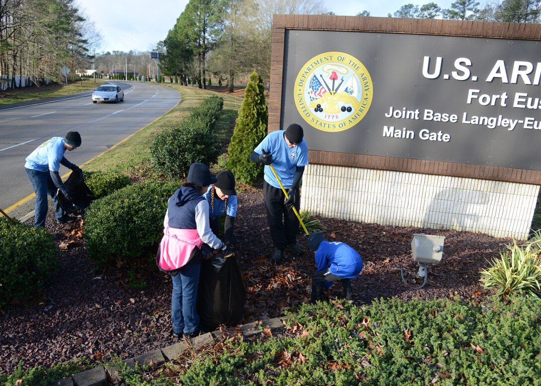 Members of the Fort Eustis chapter of the Sergeant Audie Murphy Club clean the area surrounding the Gate 1 entrance at Fort Eustis, Va., Jan. 16, 2016. Some volunteers brought their children along to participate in the cleanup project, which focused on beautifying the post’s main gate entrance. (U.S. Air Force photo by Staff Sgt. Jason J. Brown)