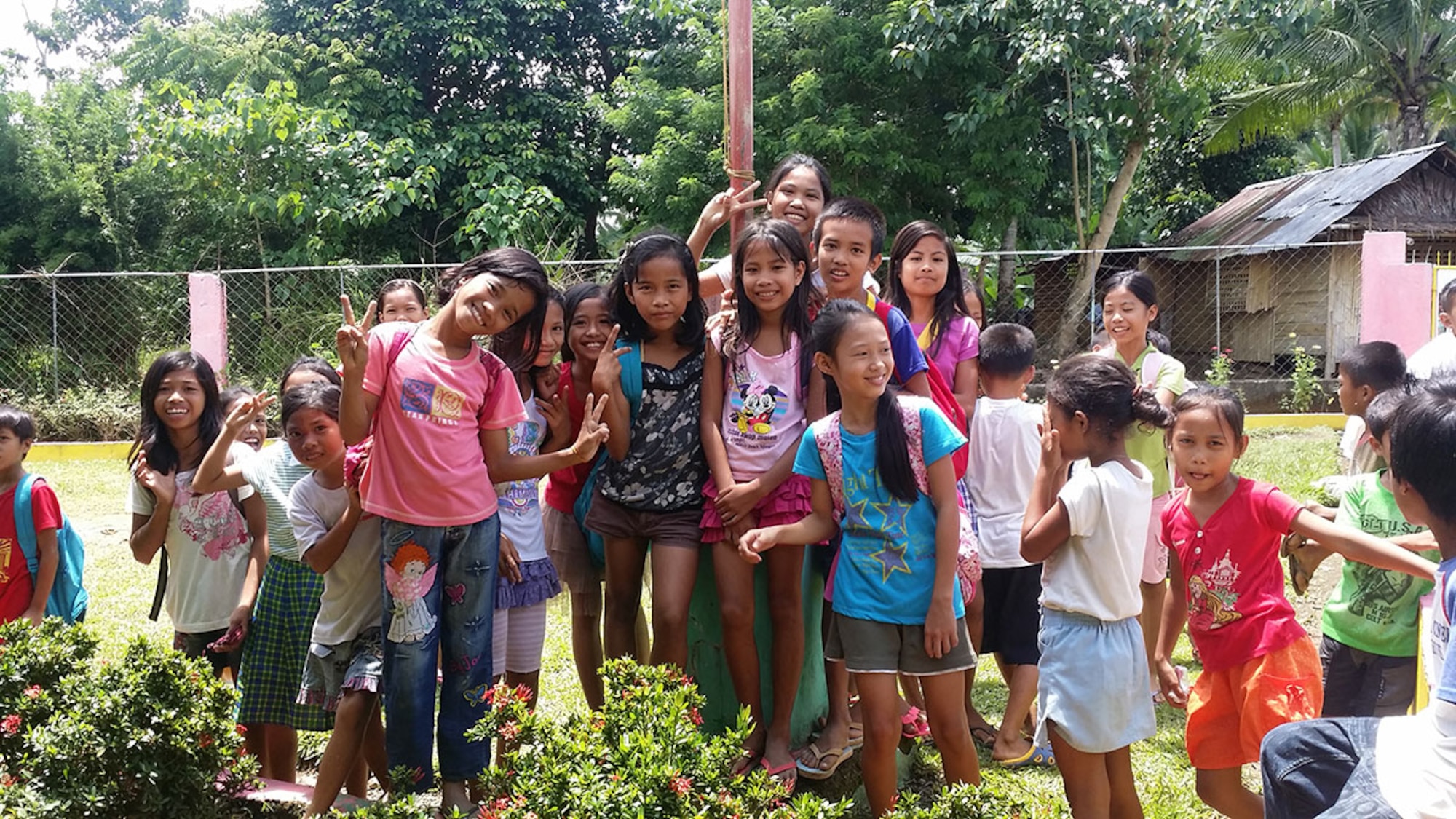Students pose outside Jaena Norte elementary school, in Panay, Philippines during a site visit. Personnel with the 673d Civil Engineer Group conducted site visits prior to starting a renovation project for the school, scheduled for March 28, as part of a humanitarian and civic assistance portion of exercise Balikatan 2016. (Courtesy photo) 






